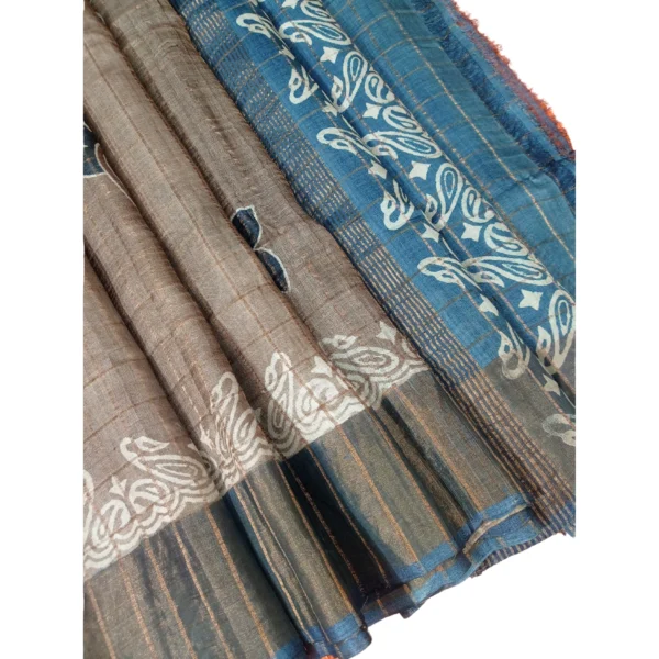 Beige and blue colour tussar silk saree with beautiful floral design
